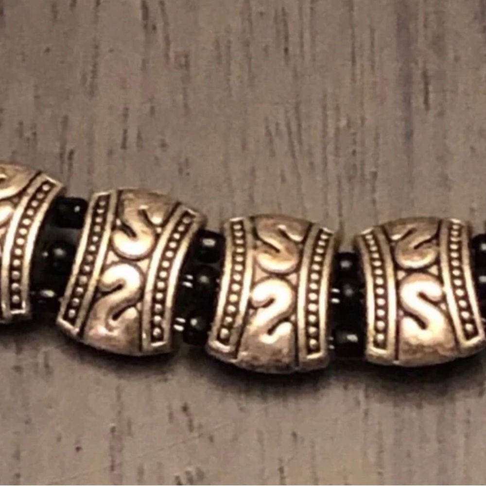 Bracelet with metal tribal spacers black metal bead accents